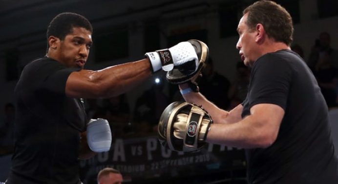 Anthony Joshua stands by Rob McCracken