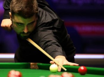 Jamie Clarke sees off Mark Allen