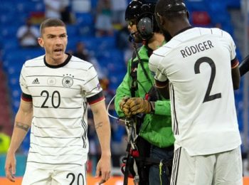 Several injured as a parachute protester flies in to the France vs Germany Euro match